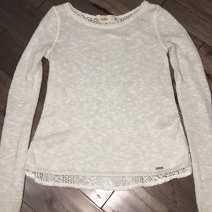 A long sleeve sweater with a lace back.